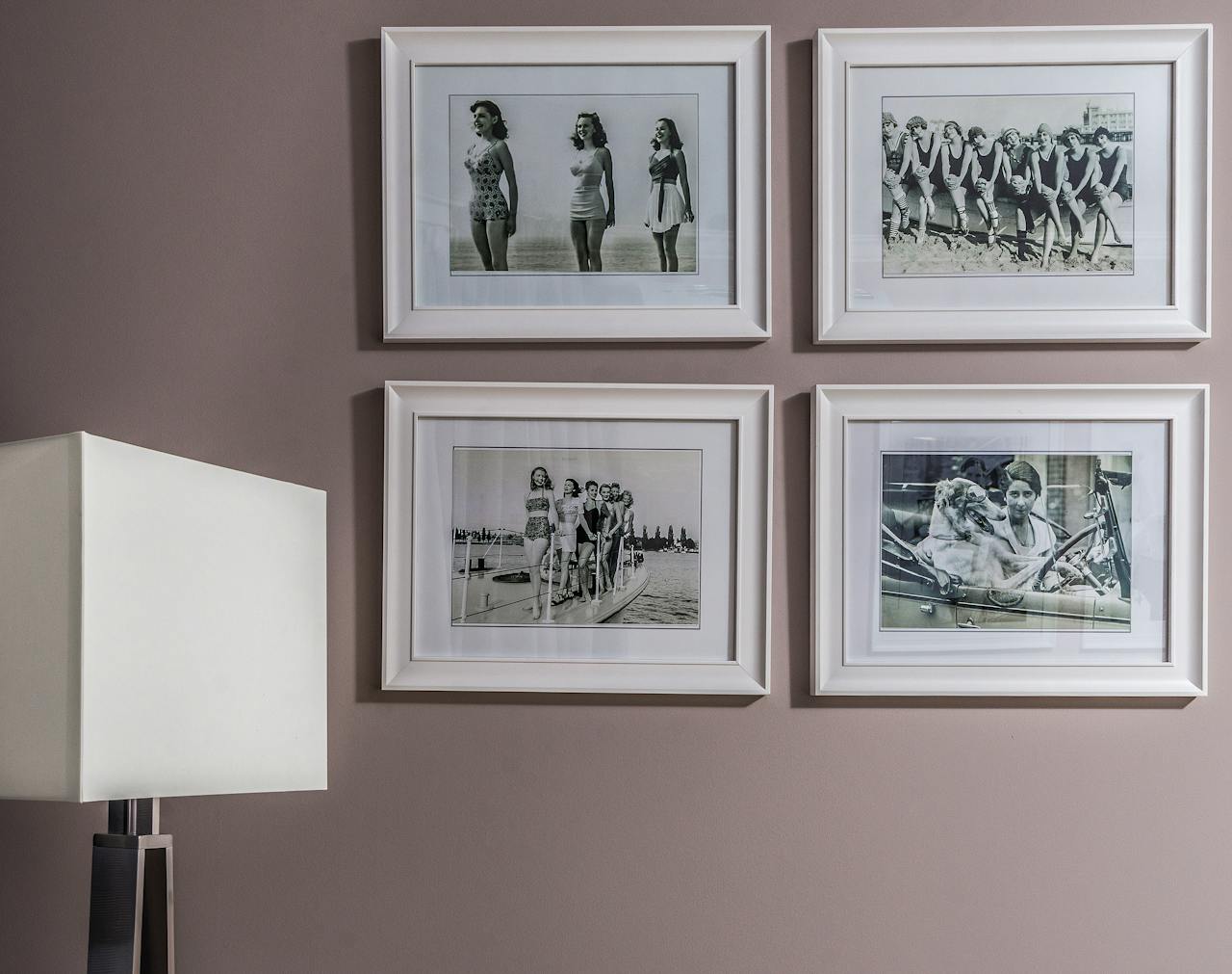 Chic interior wall decor featuring vintage black and white framed nostalgic photos.